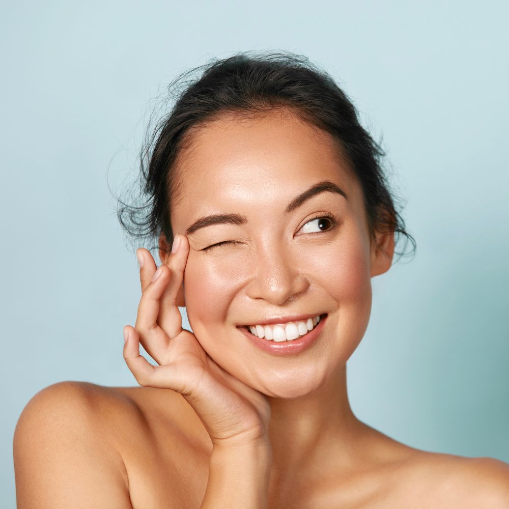 Smiling woman with healthy glowing skin for beauty and wellness support